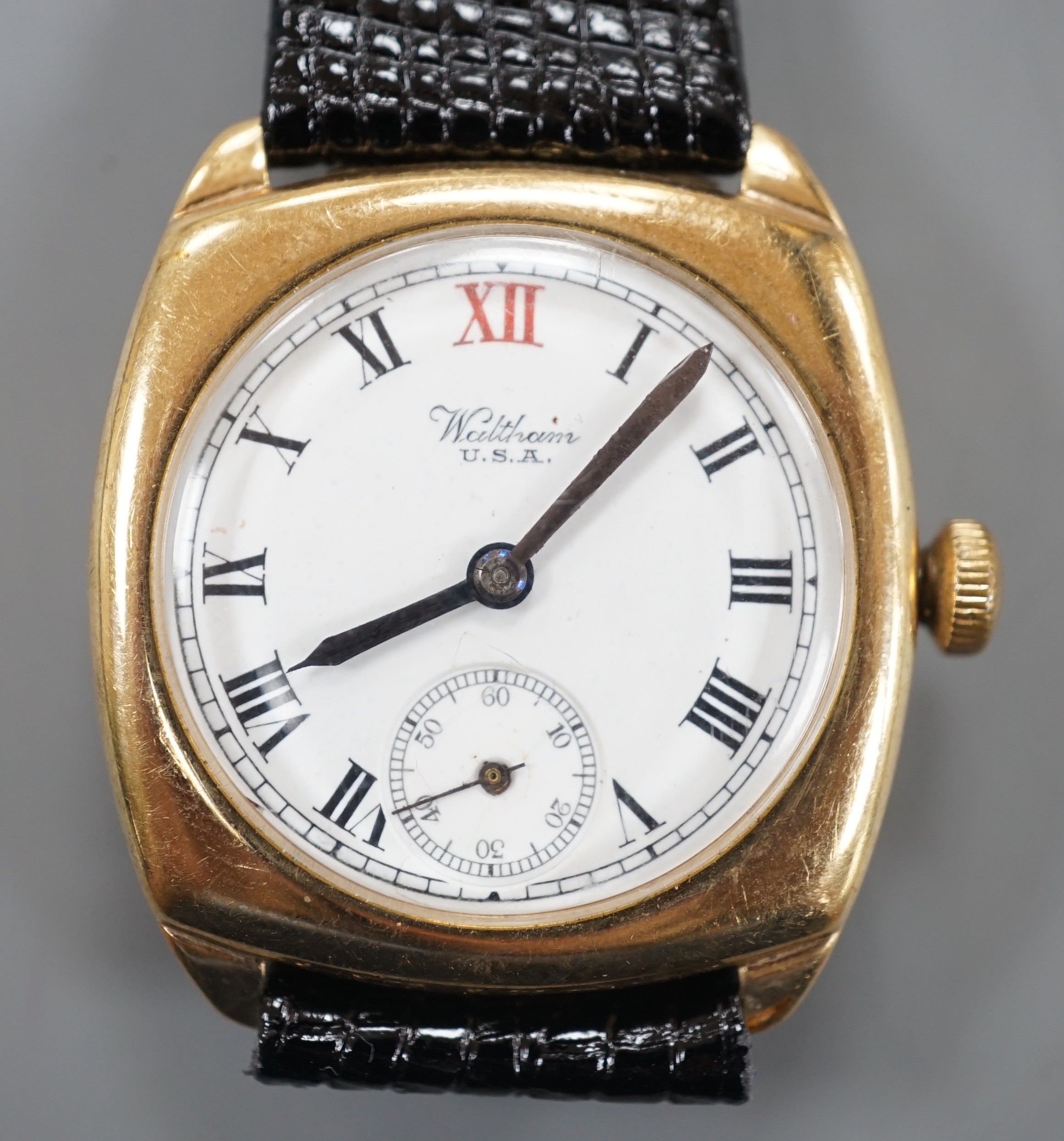 A gentleman's 1920's 9ct gold Waltham manual wind wrist watch, with Roman dial and subsidiary seconds, on later associated strap.